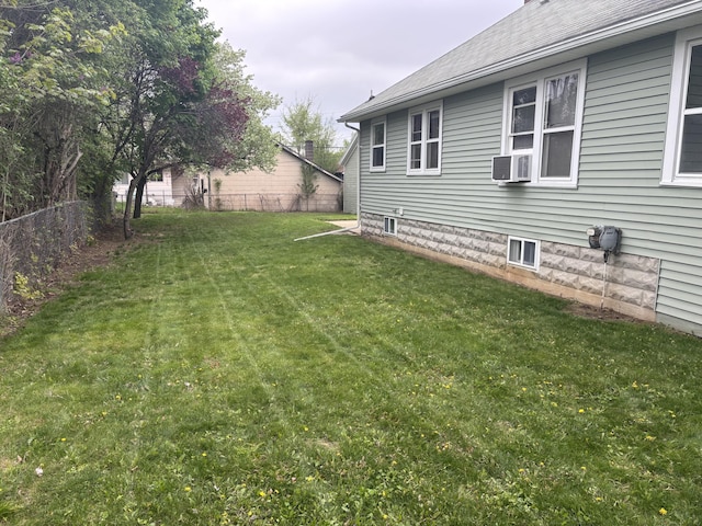 view of yard with a fenced backyard and cooling unit