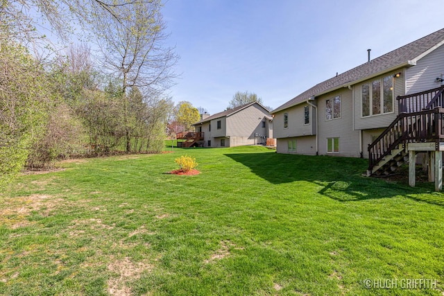 view of yard featuring stairs and a deck