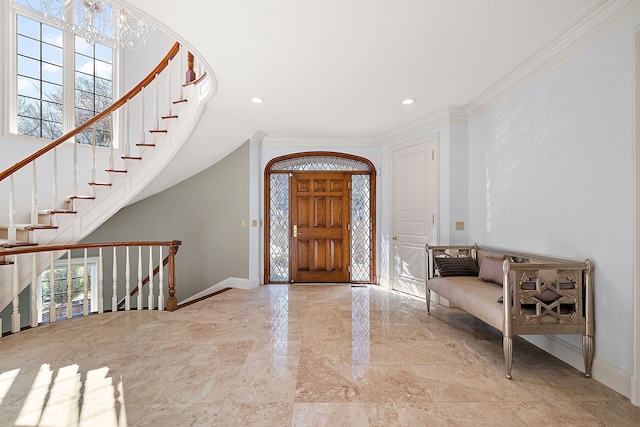 foyer entrance with baseboards, ornamental molding, and recessed lighting