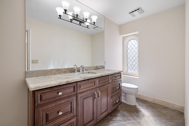 bathroom with vanity, toilet, visible vents, and tile patterned flooring