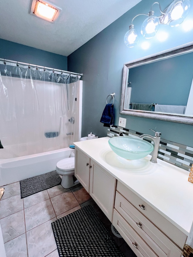 bathroom with vanity, toilet, shower / tub combo, and tile patterned floors