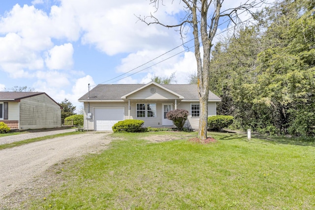 12938 Kelley Rd, Brooklyn, MI 49230 - view of front of home with a garage, driveway, a front lawn, and a shingled roof