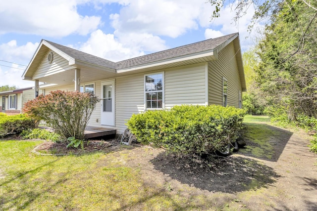 12938 Kelley Rd, Brooklyn, MI 49230 - back of house featuring a lawn and roof with shingles