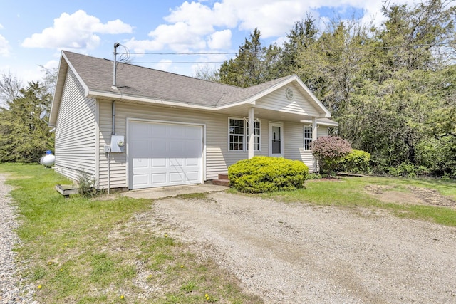 12938 Kelley Rd, Brooklyn, MI 49230 - single story home featuring driveway, an attached garage, roof with shingles, and a front lawn