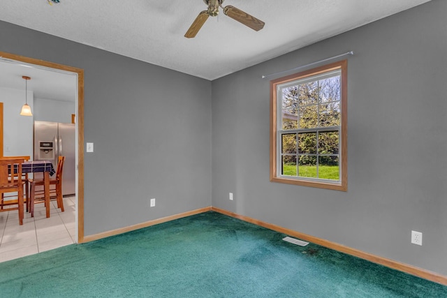 12938 Kelley Rd, Brooklyn, MI 49230 - spare room with ceiling fan, baseboards, and carpet floors