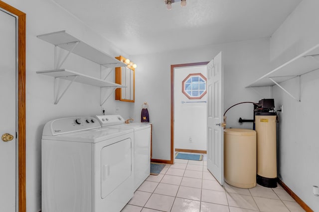 12938 Kelley Rd, Brooklyn, MI 49230 - clothes washing area with independent washer and dryer, baseboards, and light tile patterned floors