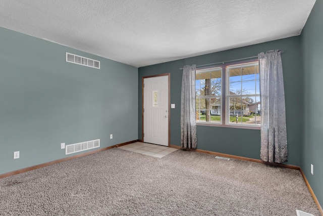 12938 Kelley Rd, Brooklyn, MI 49230 - carpeted spare room featuring a textured ceiling and baseboards