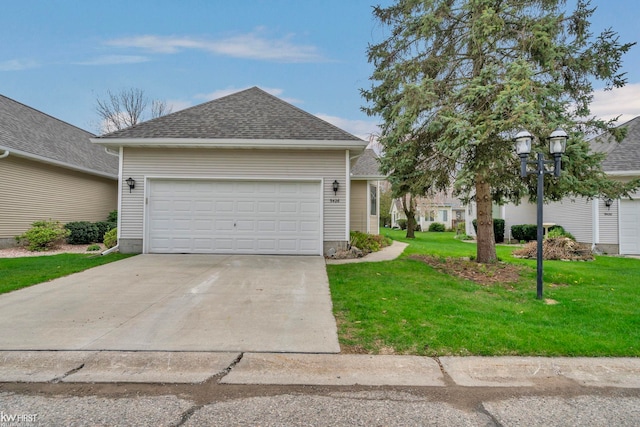 single story home with concrete driveway, a front yard, a shingled roof, and an attached garage