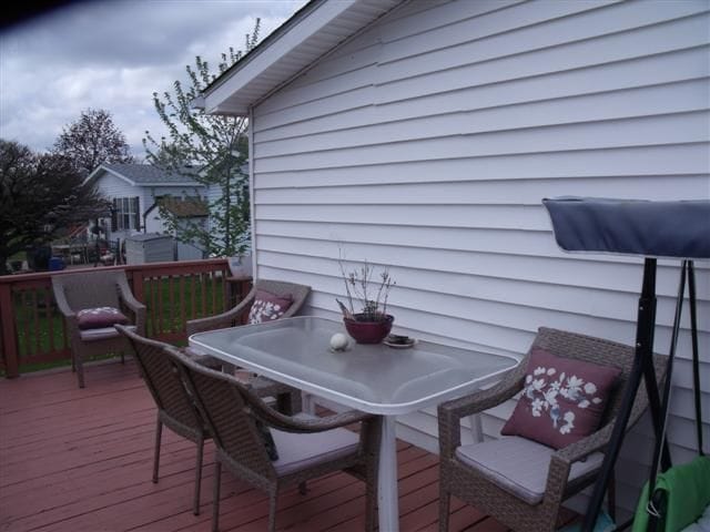 deck with outdoor dining area