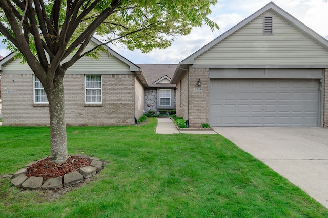 22876 Woodcreek Dr, Taylor, MI 48180 - ranch-style house featuring driveway, brick siding, a front lawn, and an attached garage