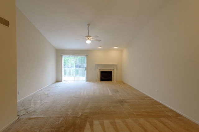 22876 Woodcreek Dr, Taylor, MI 48180 - unfurnished living room featuring ceiling fan, light carpet, a fireplace, lofted ceiling, and baseboards