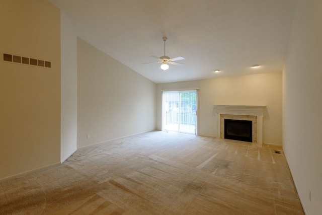 22876 Woodcreek Dr, Taylor, MI 48180 - unfurnished living room featuring a ceiling fan, light colored carpet, vaulted ceiling, a fireplace with flush hearth, and baseboards