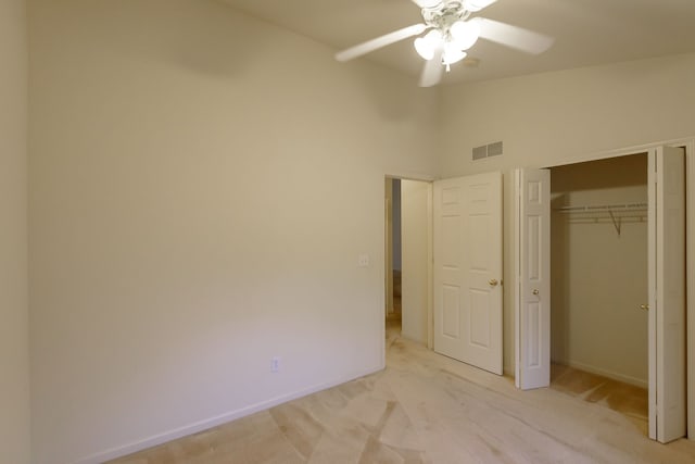 22876 Woodcreek Dr, Taylor, MI 48180 - unfurnished bedroom with light colored carpet, baseboards, a closet, vaulted ceiling, and ceiling fan