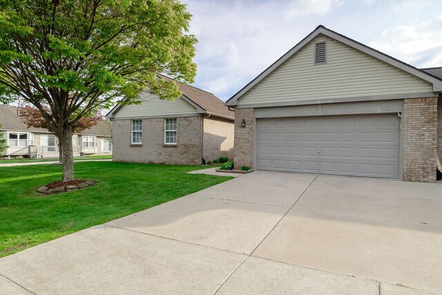 22876 Woodcreek Dr, Taylor, MI 48180 - ranch-style home with brick siding, a front lawn, and driveway