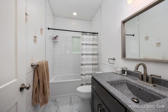 506 Fairview Ave NE, Grand Rapids, MI 49503 - full bath with toilet, marble finish floor, vanity, recessed lighting, and shower / tub combo