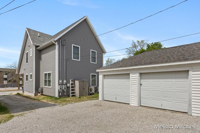 506 Fairview Ave NE, Grand Rapids, MI 49503 - view of home's exterior with a garage, an outdoor structure, and a shingled roof