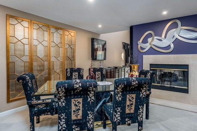 carpeted dining room with recessed lighting, a fireplace, and baseboards