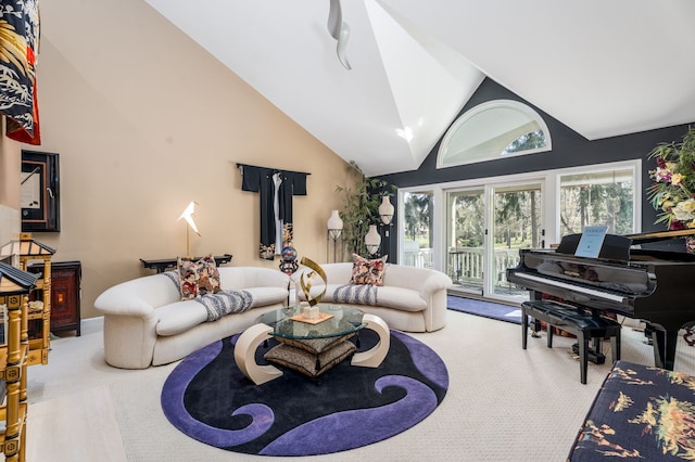 living room with carpet flooring and high vaulted ceiling