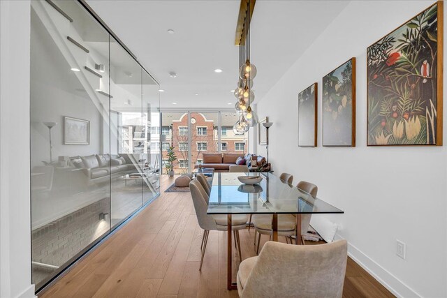 2809 Brush St, Detroit, MI 48201 - dining room with wood finished floors, baseboards, and recessed lighting