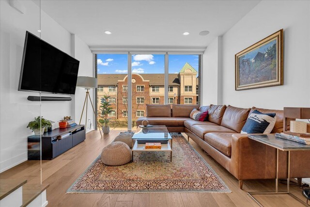 2809 Brush St, Detroit, MI 48201 - living room with baseboards, light wood finished floors, and floor to ceiling windows