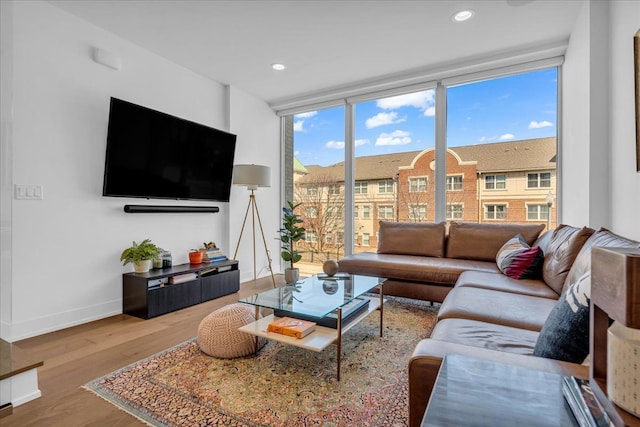 2809 Brush St, Detroit, MI 48201 - living area featuring expansive windows, wood finished floors, baseboards, and recessed lighting