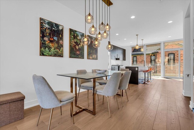 2809 Brush St, Detroit, MI 48201 - dining space featuring recessed lighting, baseboards, and light wood-style floors