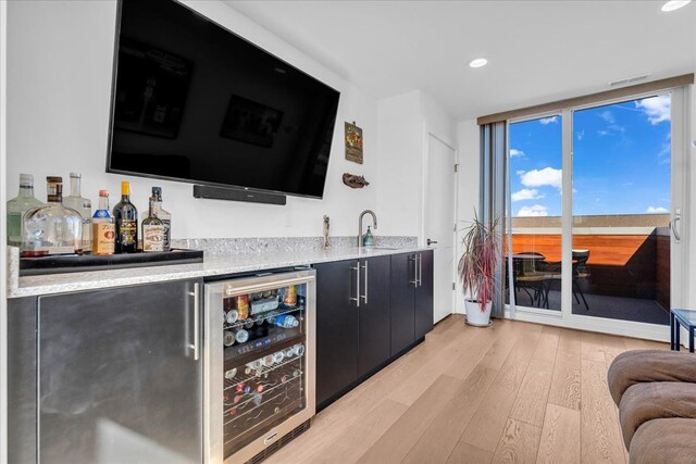 2809 Brush St, Detroit, MI 48201 - bar featuring indoor wet bar, a sink, visible vents, light wood-style floors, and wine cooler