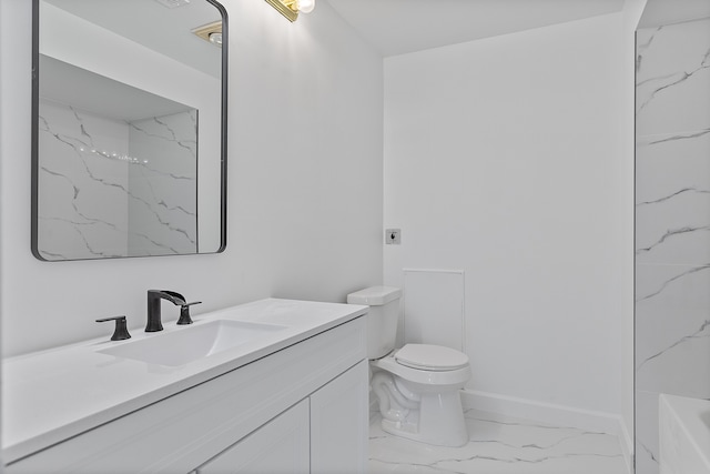 full bath featuring toilet, marble finish floor, vanity, a bathing tub, and baseboards