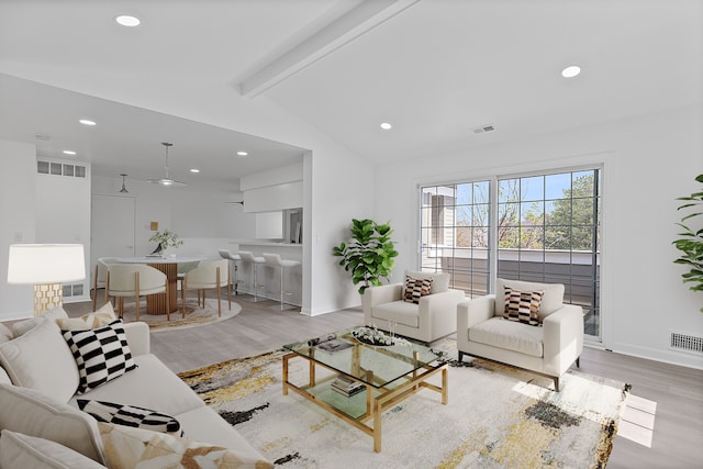 living area featuring visible vents, wood finished floors, and recessed lighting