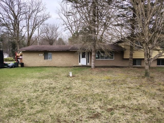 12416 Nichols Rd, Montrose, MI 48457 - rear view of house featuring a lawn