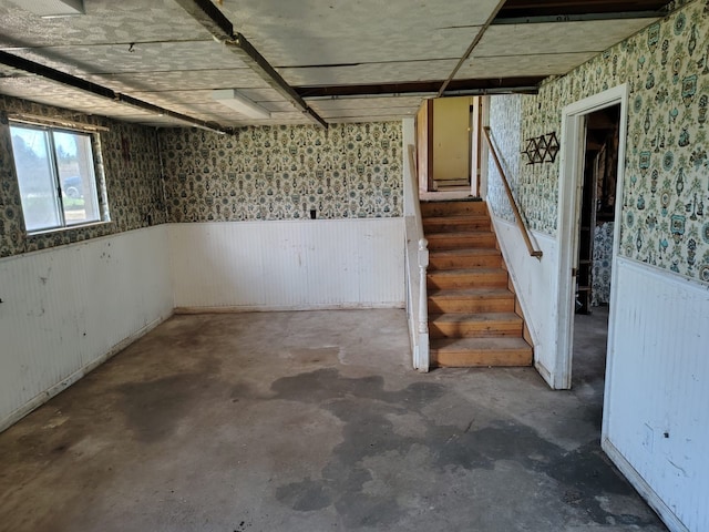 12416 Nichols Rd, Montrose, MI 48457 - below grade area with a wainscoted wall, stairway, and wallpapered walls