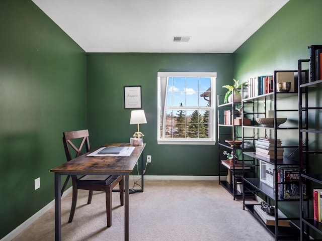 office area featuring carpet floors, baseboards, and visible vents