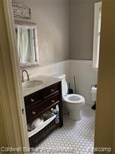 bathroom featuring vanity, toilet, and tile patterned floors