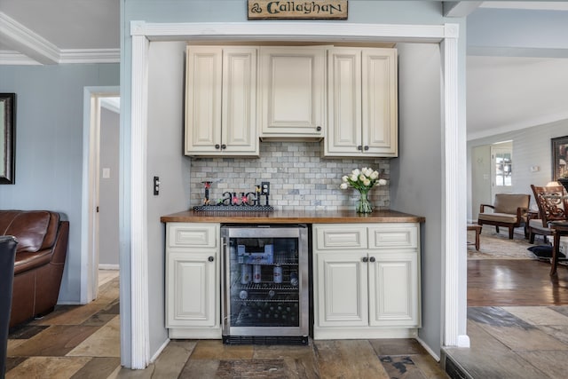 22641 N Nottingham Dr, Beverly Hills, MI 48025 - bar with beverage cooler, stone tile floors, a dry bar, tasteful backsplash, and ornamental molding