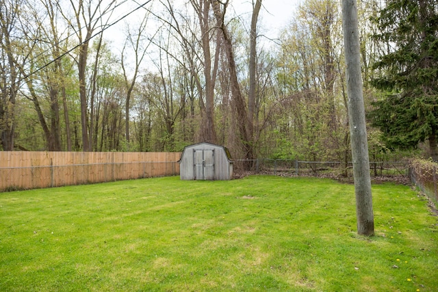 9114 Island Dr, Clay, MI 48001 - view of yard featuring a storage unit and an outbuilding