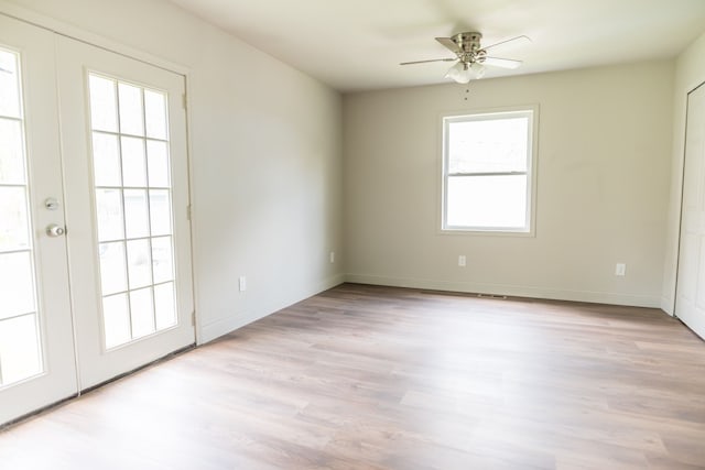 9114 Island Dr, Clay, MI 48001 - empty room with a ceiling fan, light wood finished floors, and baseboards