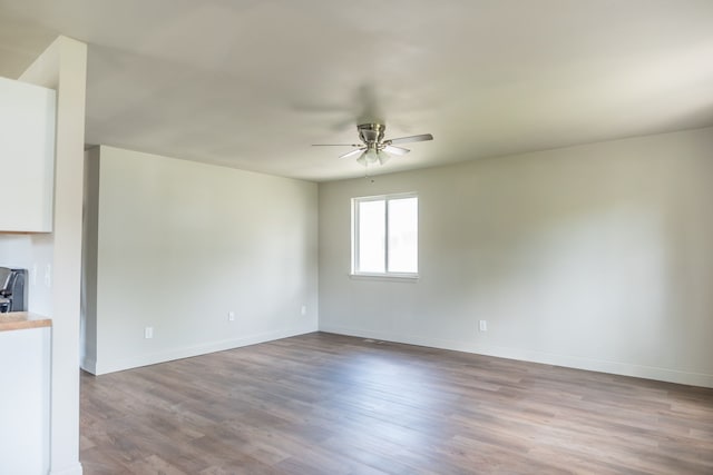 9114 Island Dr, Clay, MI 48001 - empty room featuring ceiling fan, baseboards, and wood finished floors