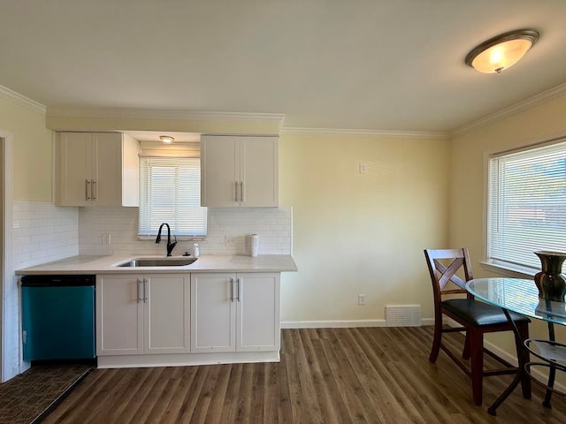 kitchen featuring a sink, dishwashing machine, dark wood-type flooring, crown molding, and light countertops