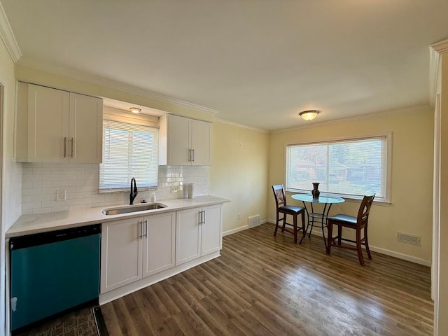 kitchen featuring a sink, ornamental molding, dark wood-type flooring, dishwasher, and decorative backsplash