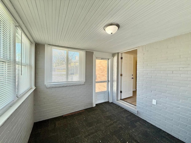 unfurnished sunroom with a wealth of natural light