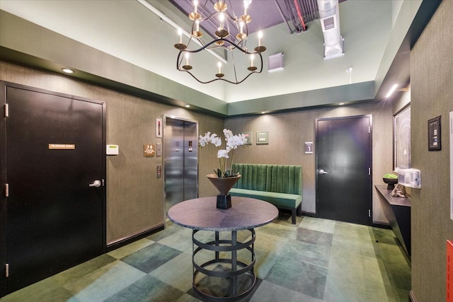 444 W Willis St Unit 204, Detroit, MI 48201 - entrance foyer featuring elevator, tile patterned floors, and a chandelier