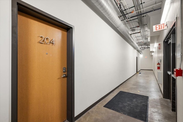 444 W Willis St Unit 204, Detroit, MI 48201 - hall with finished concrete floors and baseboards