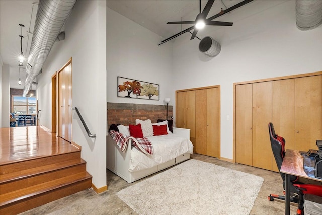 444 W Willis St Unit 204, Detroit, MI 48201 - bedroom with a towering ceiling, multiple closets, and a ceiling fan