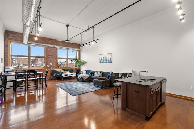 444 W Willis St Unit 204, Detroit, MI 48201 - living area with brick wall and wood-type flooring
