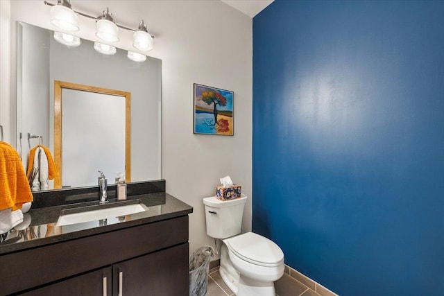 444 W Willis St Unit 204, Detroit, MI 48201 - bathroom with toilet, tile patterned flooring, vanity, and baseboards