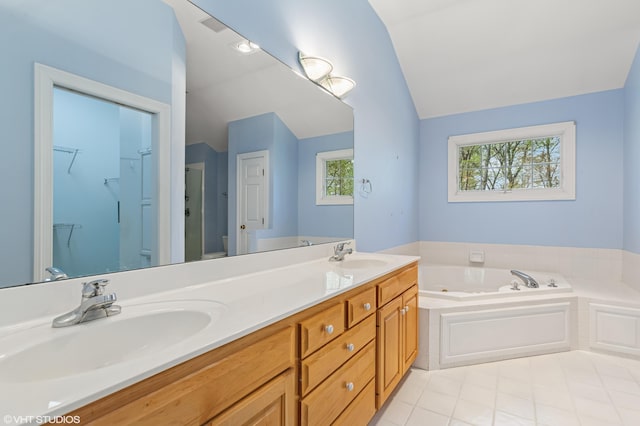 bathroom with a sink, vaulted ceiling, double vanity, and a garden tub