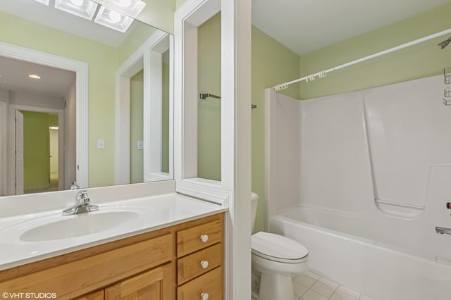 full bathroom featuring vanity, toilet, shower / washtub combination, and tile patterned floors