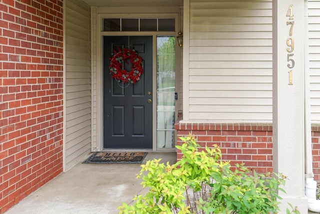 47951 Cardiff Ave Unit 118, Canton, MI 48188 - entrance to property with brick siding and covered porch