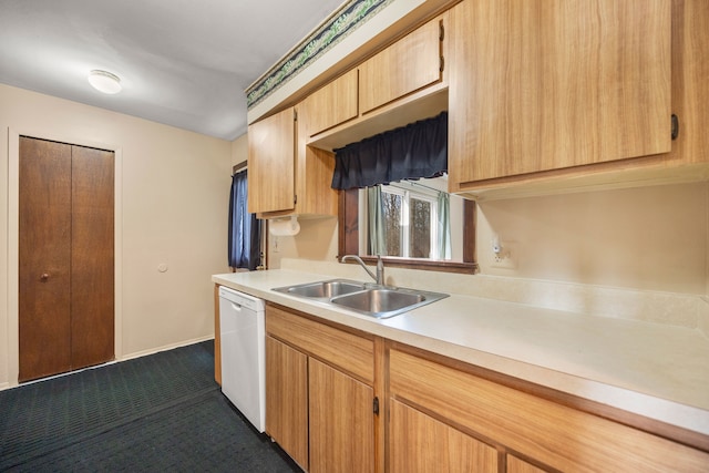 kitchen with a sink, dark carpet, baseboards, light countertops, and white dishwasher
