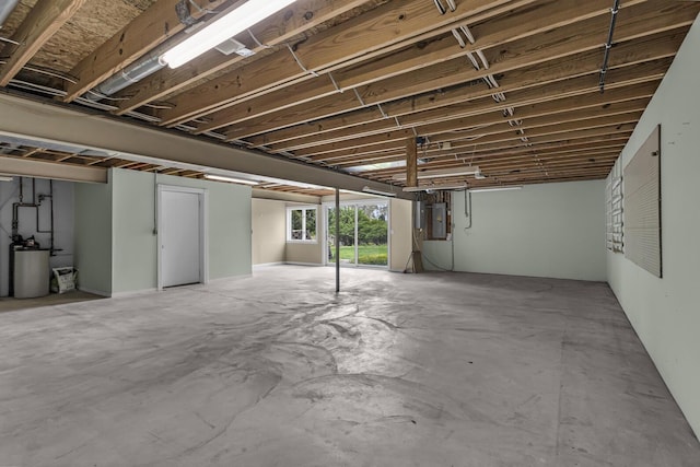 below grade area with water heater and electric panel